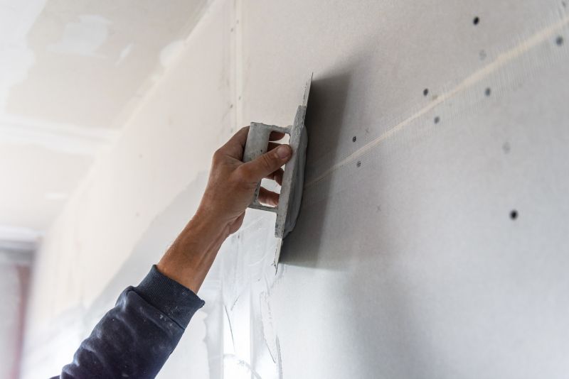 Handyman fixing drywall